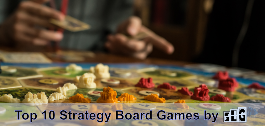 A board game player pointing at a Settlers of Catan board game that is set up and being played. Text that says "top 10 Strategy board games by" with the Streamlined Gaming logo next to it at the bottom